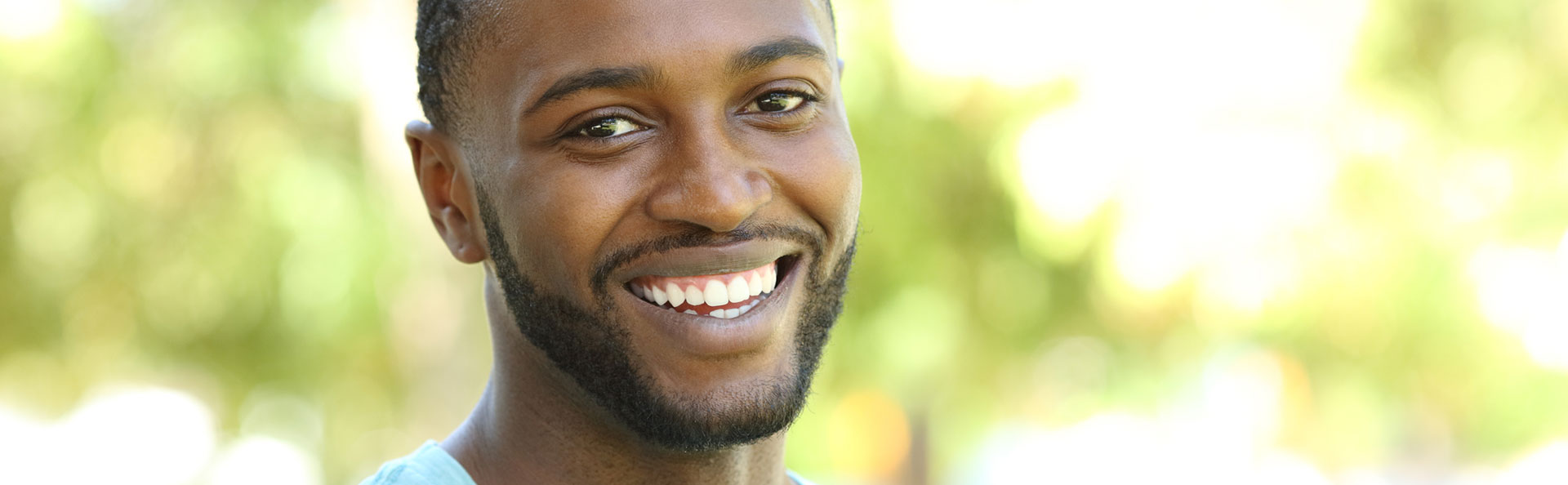 Man smiling after comprehensive oral exam